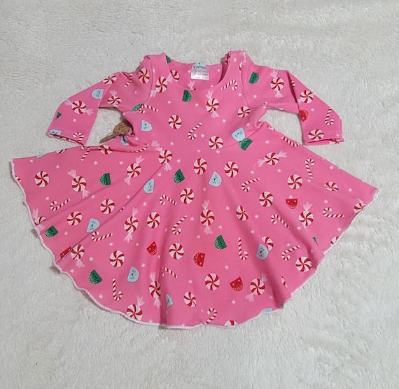 The Tofino Baby dress in size 3 months is a delightful and charming outfit  perfect for the holiday season