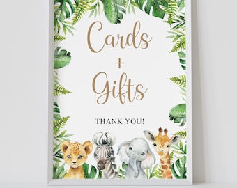 May include: A white framed sign with a green leafy border and a brown text that says "Cards + Gifts" with the words "Thank You!" below. There are four animal illustrations in the bottom corner: a lion, a zebra, an elephant, and a giraffe.