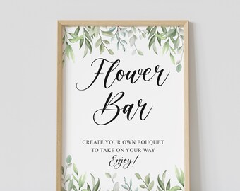 Pode incluir: Uma placa branca com moldura de madeira e borda de folhagem verde. A placa diz "Flower Bar" e "Crie seu próprio buquê para levar. Aproveite!"