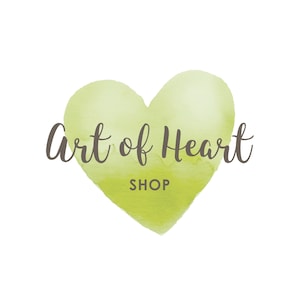 May include: A logo featuring a watercolor-style green heart on a white background. The words "Art of Heart" are written in a dark brown script above the word "SHOP" in a smaller font.