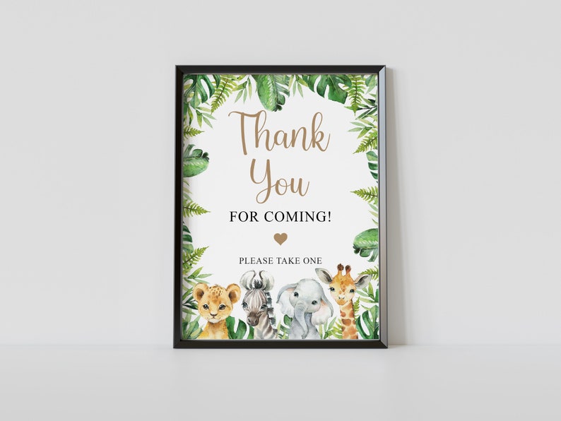 May include: A printable thank you sign with a jungle theme. The sign features a lion, zebra, elephant, and giraffe surrounded by green leaves and the text "Thank You for Coming!" with a heart.