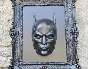 Muurdecoratie met een lijst geïnspireerd op Batman en Catwoman.