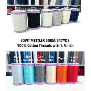 May include: Assortment of 50 weight Mettler cotton thread spools with a silk finish. The spools are 500 meters long and come in colors like white, black, grey, blue, red, and orange.
