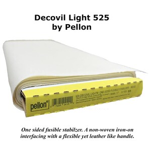 May include: A roll of white Decovil Light 525 one-sided fusible stabilizer by Pellon. The product is a non-woven iron-on interfacing with a flexible, leather-like handle. The yellow packaging label displays the product name, barcode, and 17 inch width.