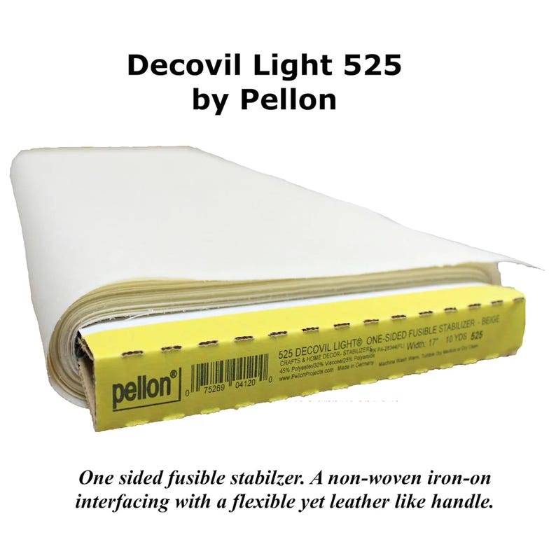 May include: A roll of white Decovil Light 525 one-sided fusible stabilizer by Pellon. The product is a non-woven iron-on interfacing with a flexible, leather-like handle. The yellow packaging label displays the product name, barcode, and 17 inch width.