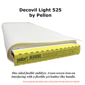 May include: A roll of Pellon Decovil Light 525 one-sided fusible stabilizer. The beige non-woven iron-on interfacing is wrapped around a yellow cardboard core featuring the Pellon logo, a barcode, and product specifications including a 17-inch width.