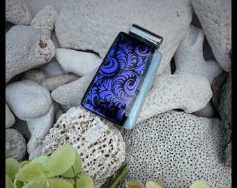 Glass pendant is rectangular shape. Colors are sparkling dichroic purple and black patterned paisley has iradescent glass depth & texture.