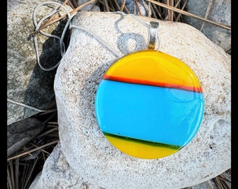 Round circle glass pendant bright yellow and aqua blue with a playful orange stripe and a  shimmering silver bail.