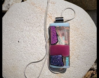 Glass fused pendant custom made by Jeanne. Colors sparkling dichroic pink, purple and shimmering green.