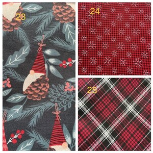 May include: Three fabric swatches with different patterns. The first swatch has a dark blue background with a white and red gnome pattern. The second swatch has a red background with a white snowflake pattern. The third swatch has a red and black plaid pattern.