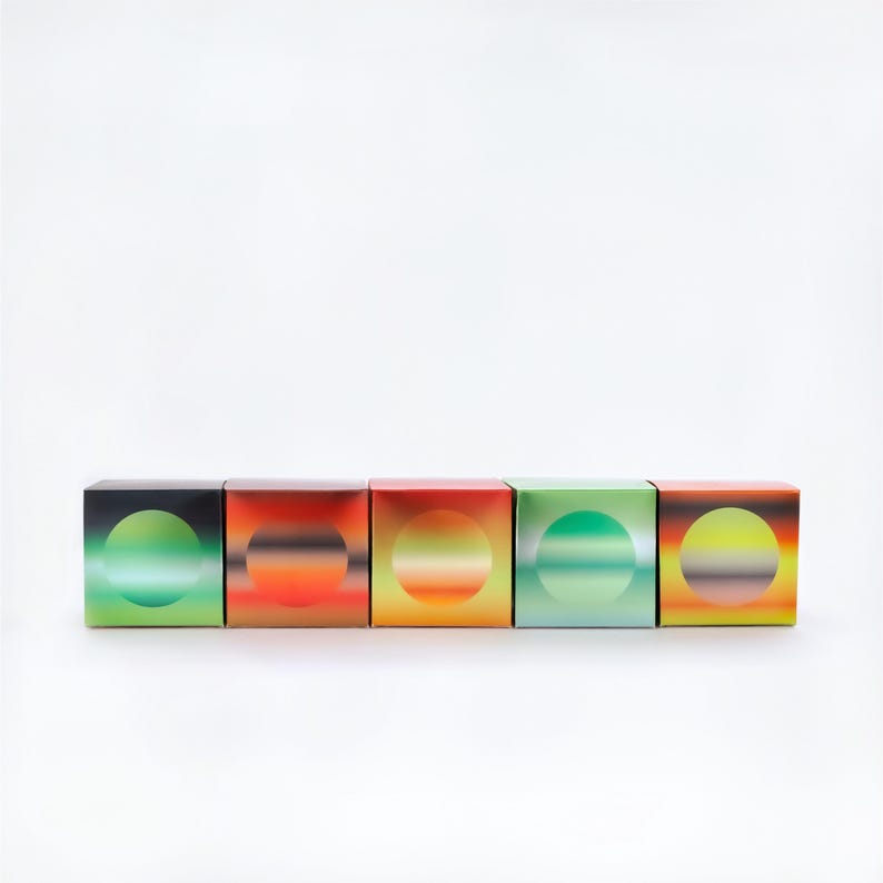 May include: Five square boxes with a gradient design. Each box has a circular design in the centre, with colours ranging from green to orange. The boxes are arranged in a row against a white background.