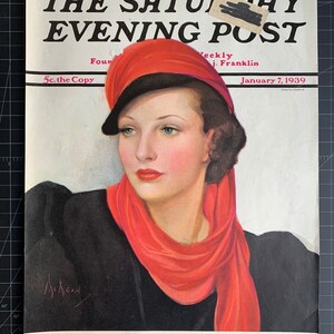 May include: The cover of The Saturday Evening Post magazine from January 7, 1939, features a woman wearing a red hat and scarf, with the title "STREAMLINED HEART" by Samson Raphaelson.