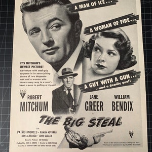 May include: Black and white movie poster for "The Big Steal" starring Robert Mitchum, Jane Greer, and William Bendix. The poster features a tagline: "A man of ice... A woman of fire... A guy with a gun... and a deadly goal!"