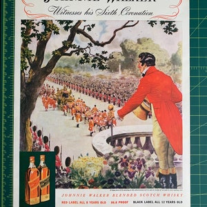 May include: A vintage advertisement for Johnnie Walker Blended Scotch Whisky. The image features a man in a red coat watching a procession of people in a parade. The text on the ad reads "Johnnie Walker Witnesses his Sixth Coronation" and includes the tagline "Red Label All 8 Years Old 86.8 Proof Black Label All 12 Years Old".