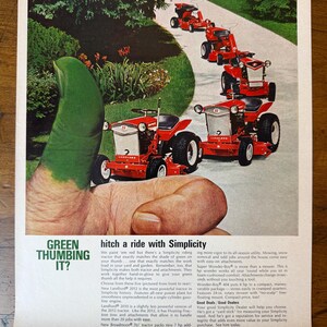 May include: An advertisement featuring several red Simplicity riding tractors on a white path, with green foliage in the background. The ad includes the text "Green Thumbing It?" and "hitch a ride with Simplicity."