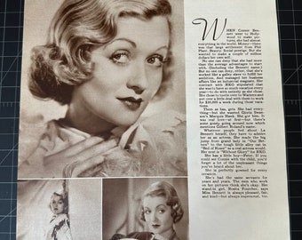 May include: A black and white photo of a woman with short, wavy blonde hair. She is wearing a dark dress and a pearl necklace. The photo is from a magazine and includes the text "CONSTANCE BENNETT".