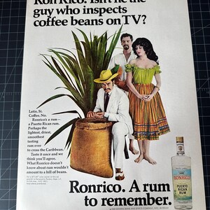 May include: A vintage Ronrico Puerto Rican Rum advertisement. The image shows a man in a white suit and yellow hat, a woman in a green and orange dress, and a bottle of rum. The text reads "Ronrico. A rum to remember."