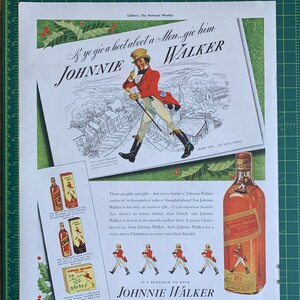 May include: A vintage advertisement for Johnnie Walker blended scotch whisky. The ad features a cartoon illustration of a man in a red coat walking across a snowy landscape. The text reads "& ye gie a hoot about a Mon...gie him WALKER JOHNNIE" and "It's sensible to give JOHNNIE WALKER BLENDED SCOTCH WHISKY".