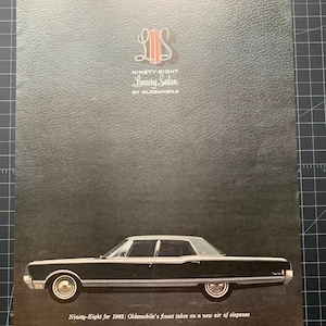 Vintage 1965 oldsmobile ninety-eight sedan print advertisement