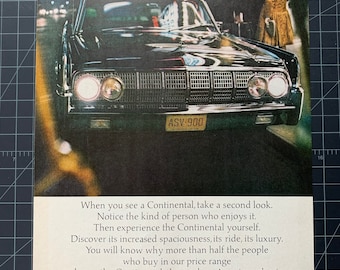May include: Vintage advertisement for a black Lincoln Continental car. The car is parked on a street with its headlights on. The ad copy reads "Lincoln Continental, the modern American classic."