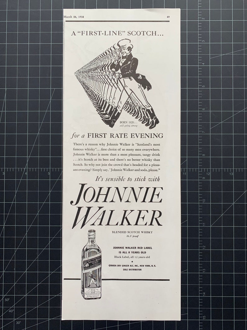 May include: Black and white vintage advertisement for Johnnie Walker blended scotch whisky. The ad features a line of men walking in a single file line, with the text "A 'FIRST-LINE' SCOTCH... for a FIRST RATE EVENING". The ad also features a bottle of Johnnie Walker Red Label scotch whisky with the text "JOHNNIE WALKER RED LABEL IS ALL 8 YEARS OLD".
