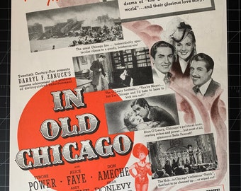 May include: A vintage movie poster for the film "In Old Chicago" starring Tyrone Power, Alice Faye, and Don Ameche. The poster features a red circle with the film's title in white text. The poster also includes images of the actors and scenes from the film, including a depiction of the Great Chicago Fire.