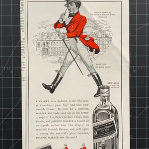 May include: A vintage advertisement for Johnnie Walker blended scotch whisky. The ad features a cartoon illustration of a man in a red coat and top hat walking with a cane. The text reads "Mind what your Webster has to say about a WALKER!" and "It's sensible to stick with Johnnie Walker Blended Scotch Whisky".