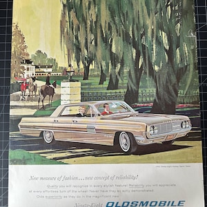 Vintage 1962 Oldsmobile Ninety-Eight Holiday Sports Sedan Print Ad