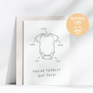 May include: A white greeting card featuring a black line drawing of a baby bodysuit with arrows pointing to the head, arms, and legs. The text reads, "YOU'VE TOTALLY GOT THIS!" and a circular peach-colored badge says "PRINTABLE CARD" with a printer icon.