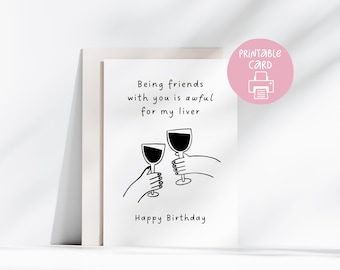 May include: A white birthday card with a humorous illustration of two hands toasting wine glasses. The card features the text: "Being friends with you is awful for my liver" and "Happy Birthday."
