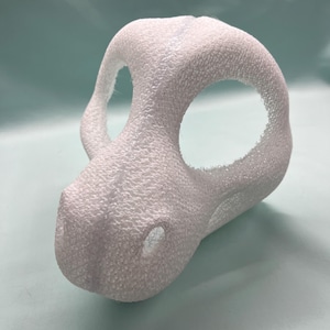 May include: White foam blank fursuit head base with two eye holes and a nose hole.