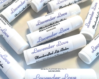 May include: An assortment of white lip balm tubes with the words "Lavender Love" in a purple script. The text "Handcrafted Lip Balm" is also visible. The brand name "RECONNECT SKINCARE" is printed on some tubes.