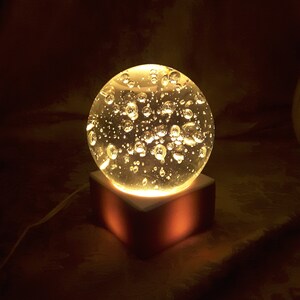 Art Glass Sphere Clear Controlled Bubbles sphere on light base Beautiful and unique