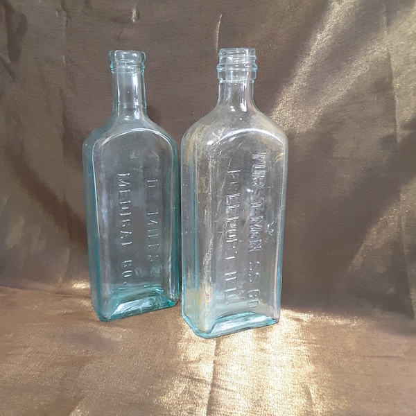 Two Antique Glass Medicine Bottles 8.25" tall Dr. Miles & Furst-McNess Co.