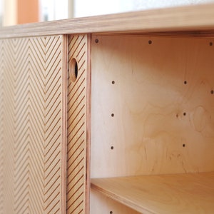 Inside detail view of a Scandinavian sideboard that shows the shelves.