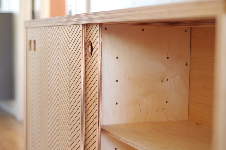 Inside detail view of a Scandinavian sideboard that shows the shelves.