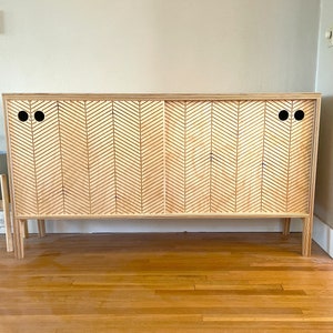 Modern scandinavian sideboard with two sliding doors in a front view