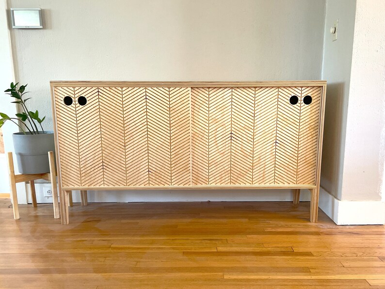 Modern scandinavian sideboard with two sliding doors in a front view