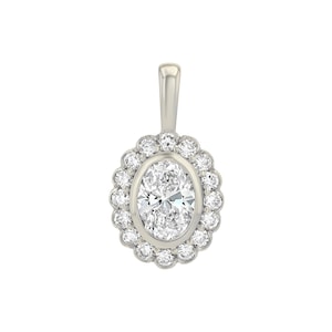 May include: A silver-toned pendant featuring a central oval-cut clear gemstone surrounded by a halo of sixteen small round-cut clear stones. The pendant includes a smooth, vertical bail at the top for attachment to a chain or necklace.