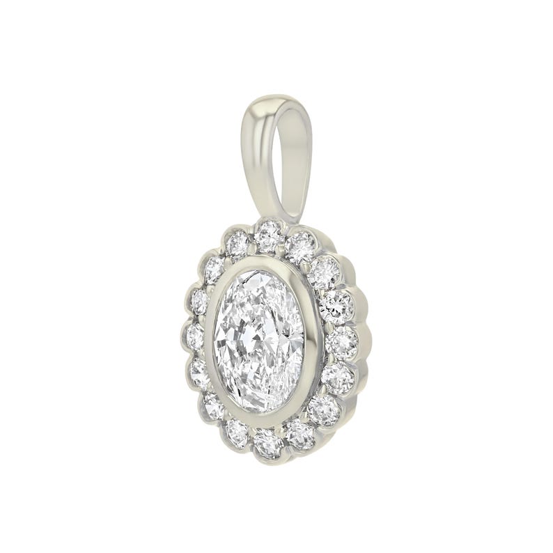 May include: A silver-toned pendant featuring a central oval-cut clear gemstone surrounded by a halo of twelve small round-cut clear stones. The pendant includes a smooth, polished bail at the top for attachment to a chain or necklace.