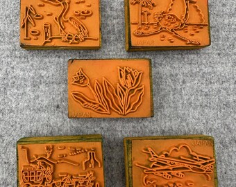 Sellos de caucho antiguos: pelícano, avestruz, tulipanes, diligencia y avión. Hechos en Japón.