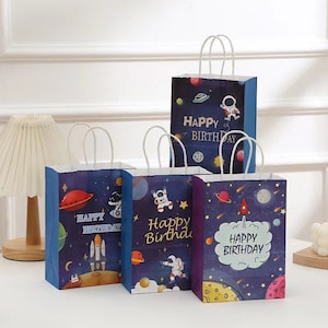Confezione regalo da 12 pezzi Sacchetti di carta Kraft Sacchetti per la spesa per bomboniere Natale Baby Shower Matrimonio Compleanno per bambini Astronauta Spazio esterno Pianeta Razzo