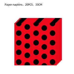 May include: A stack of 20 red paper napkins with a black polka dot pattern. The napkins are 33 cm in size.