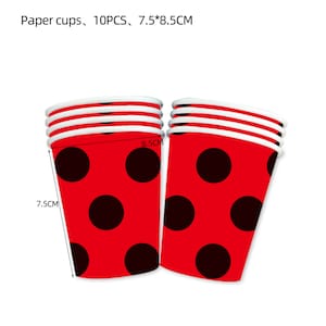 May include: A set of 10 red paper cups with black polka dots. The cups are 7.5 inches tall and 8.5 inches in diameter.