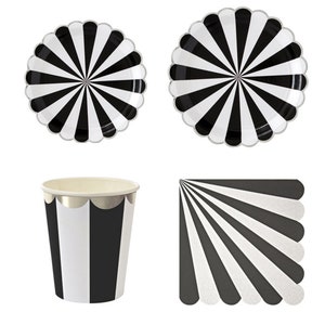 May include: Black and white striped paper plates, cups and napkins. The plates and napkins have a scalloped edge. The cups have a silver rim.