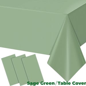 May include: Sage green table cover and three matching placemats. The tablecloth is folded over a corner, showing the texture and color. The text "Sage Green / Table Cover" is at the bottom.