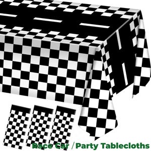 May include: A black and white chequered tablecloth with a racing track design. The tablecloth is rectangular and features a repeating pattern of black and white squares. Three matching placemats are also visible. The text "Race Car / Party Tablecloths" is at the bottom.