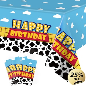 May include: A blue and white tablecloth with a sky and cloud design, featuring the words "HAPPY BIRTHDAY" in yellow and red. The tablecloth also has a black and white cow print pattern. Includes matching party invitations.