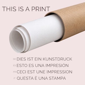 May include: A white paper print partially rolled inside a cylindrical brown cardboard shipping tube. The text THIS IS A PRINT is printed at the top, followed by the phrases DIES IST EIN KUNSTDRUCK, ESTO ES UNA IMPRESI&Oacute;N, CECI EST UNE IMPRESSION, and QUESTA &Egrave; UNA STAMPA.