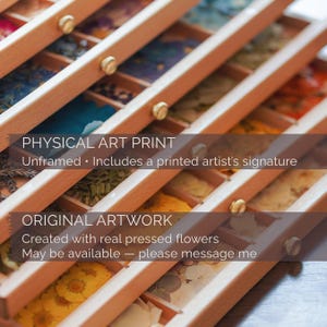 May include: A wooden storage box with multiple compartments containing various colorful pressed flowers. The text on the image reads: PHYSICAL ART PRINT Unframed &bull; Includes a printed artist's signature and ORIGINAL ARTWORK Created with real pressed flowers May be available &mdash; please message me.